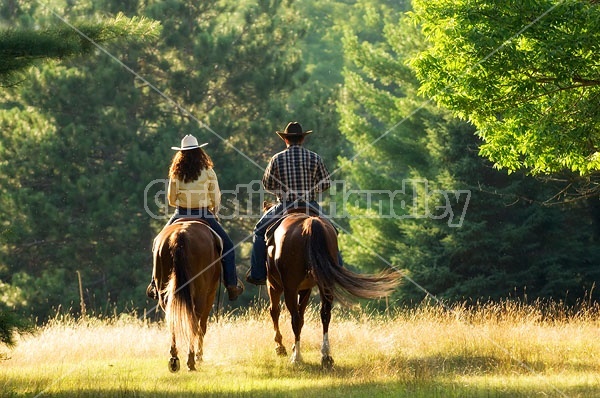 Husband and Wife Trail Riding Together