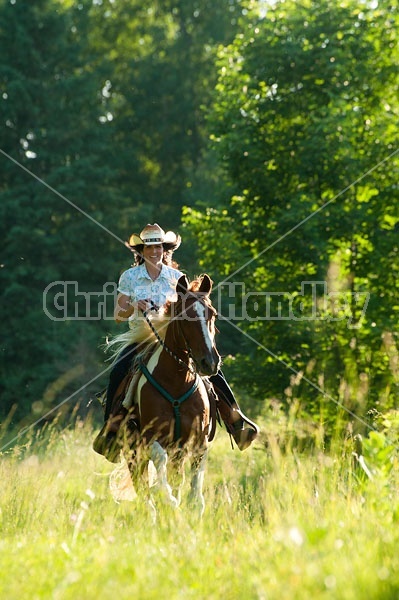 Woman riding Spotted Saddle Horse