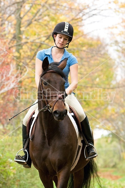 Young woman horseback riding