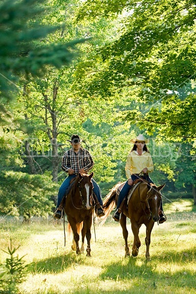 Husband and Wife Trail Riding Together