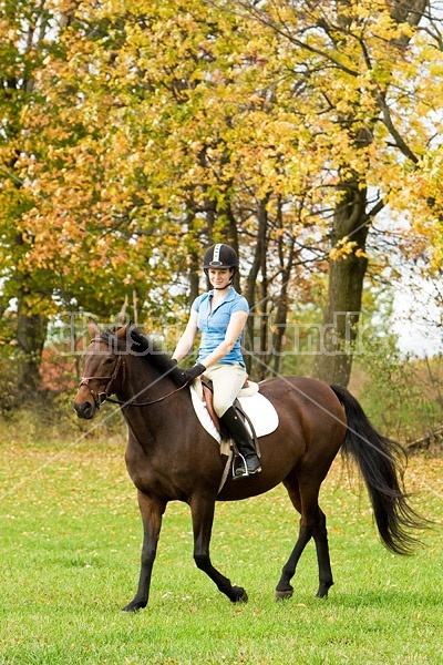 Young woman horseback riding