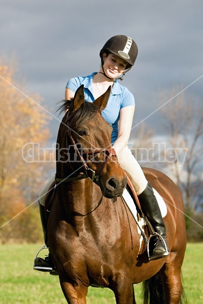 Young woman horseback riding