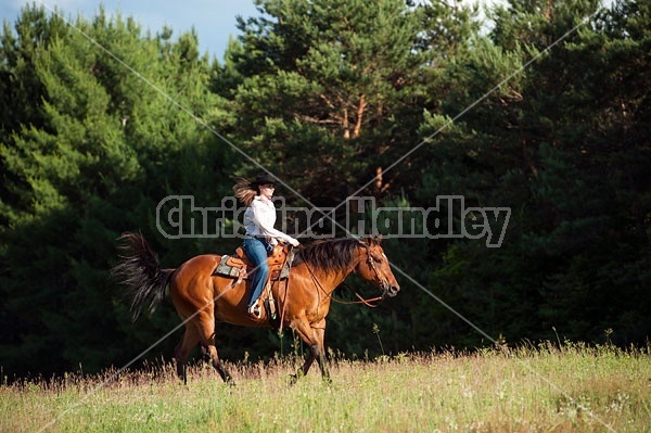 Young woman trail riding in Ontario Canada