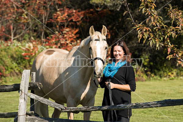 Woman with a palomino horse