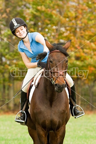 Young woman horseback riding