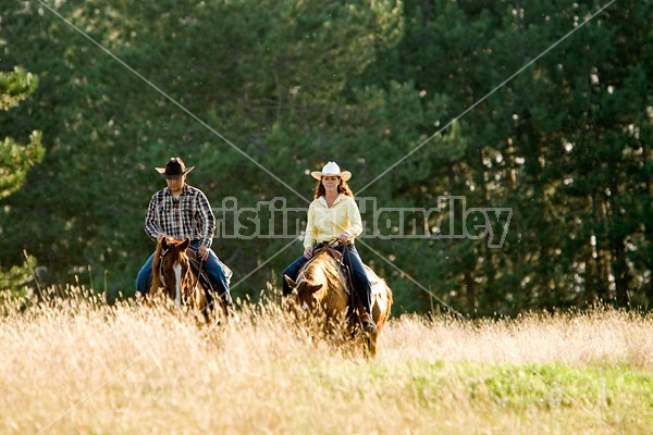 Husband and Wife Trail Riding Together