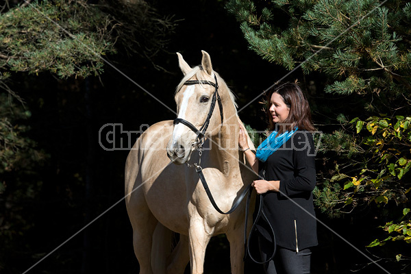 Woman with a palomino horse