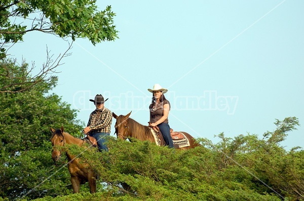 Young couple horseback riding