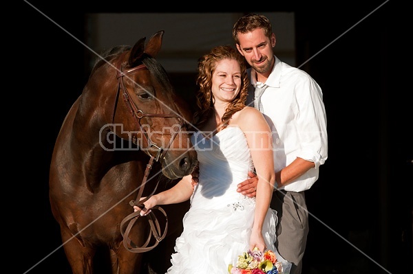 Bride and groom with horse