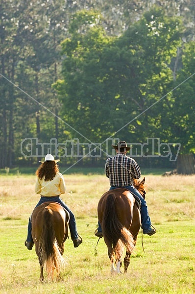 Husband and Wife Trail Riding Together