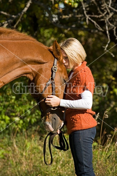 Young woman with her horse