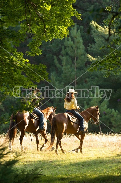 Husband and Wife Trail Riding Together