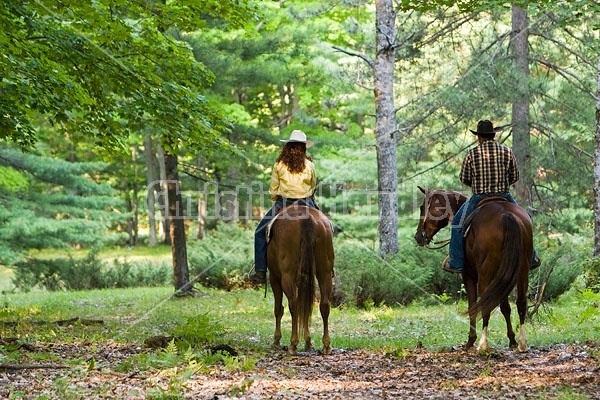 Husband and Wife Trail Riding Together