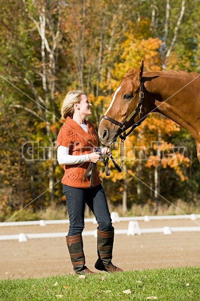 Young woman with her horse