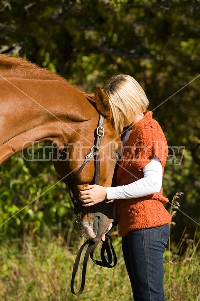 Young woman with her horse