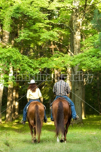 Husband and Wife Trail Riding Together