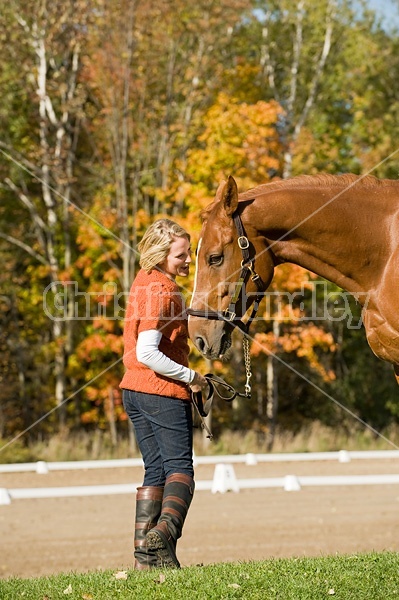 Young woman with her horse